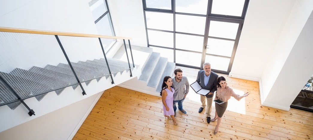 Couple Looking At House Features With Estate Agents