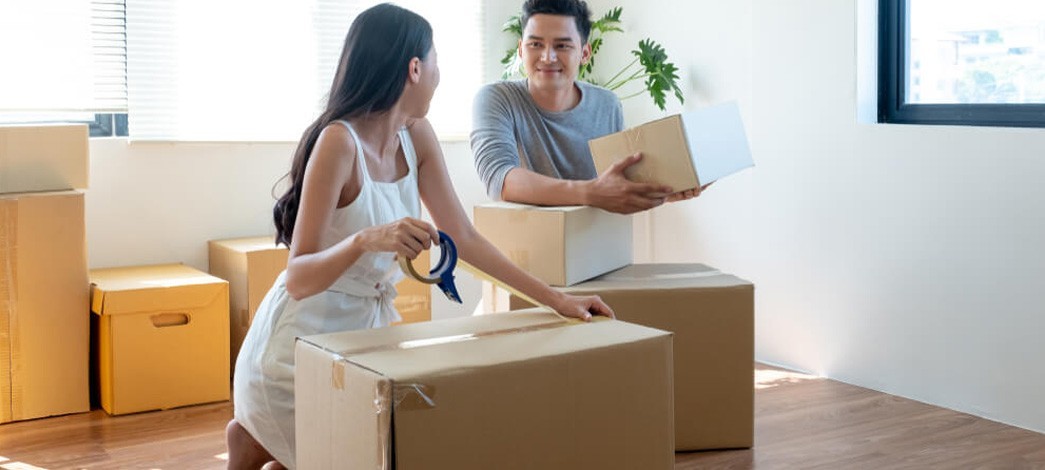 Couple Unpacking Boxes