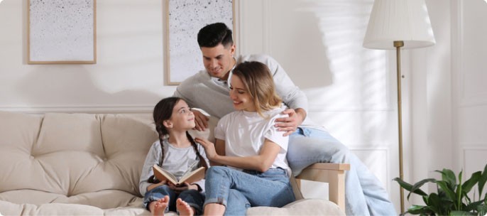 Couple with child in a new home