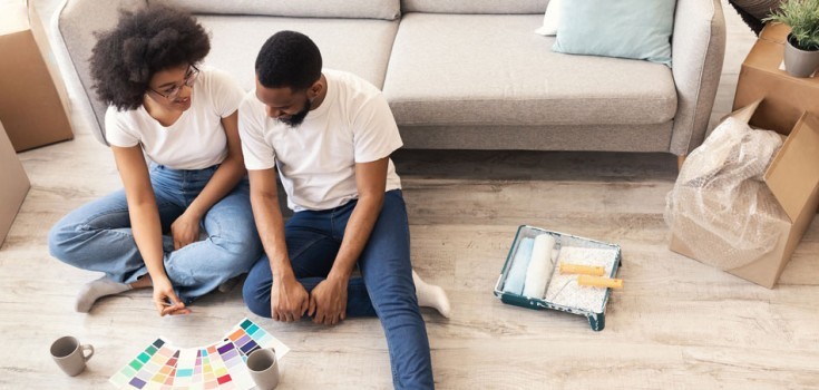 Couple Looking At Paint Charts
