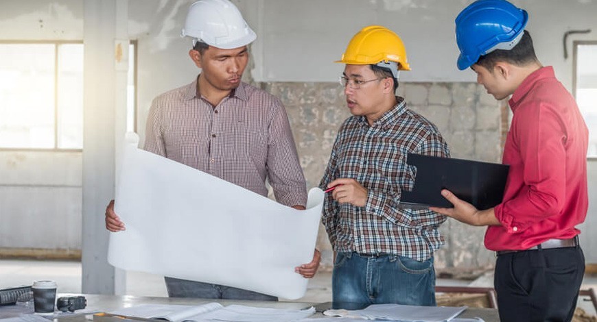 Builders And Architect Looking At Plans Mobile